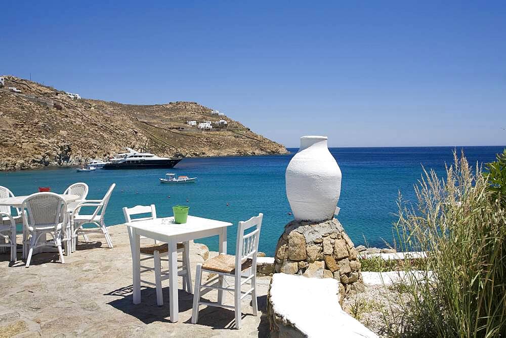 Patio overlooking ships in ocean bay