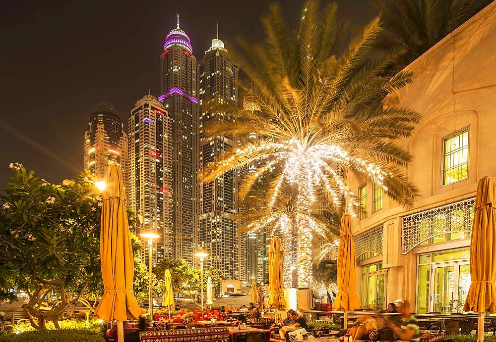 Illuminated high rise buildings in Dubai cityscape, Dubai Emirate, United Arab Emirates