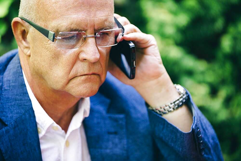 Hispanic businessman talking on cell phone