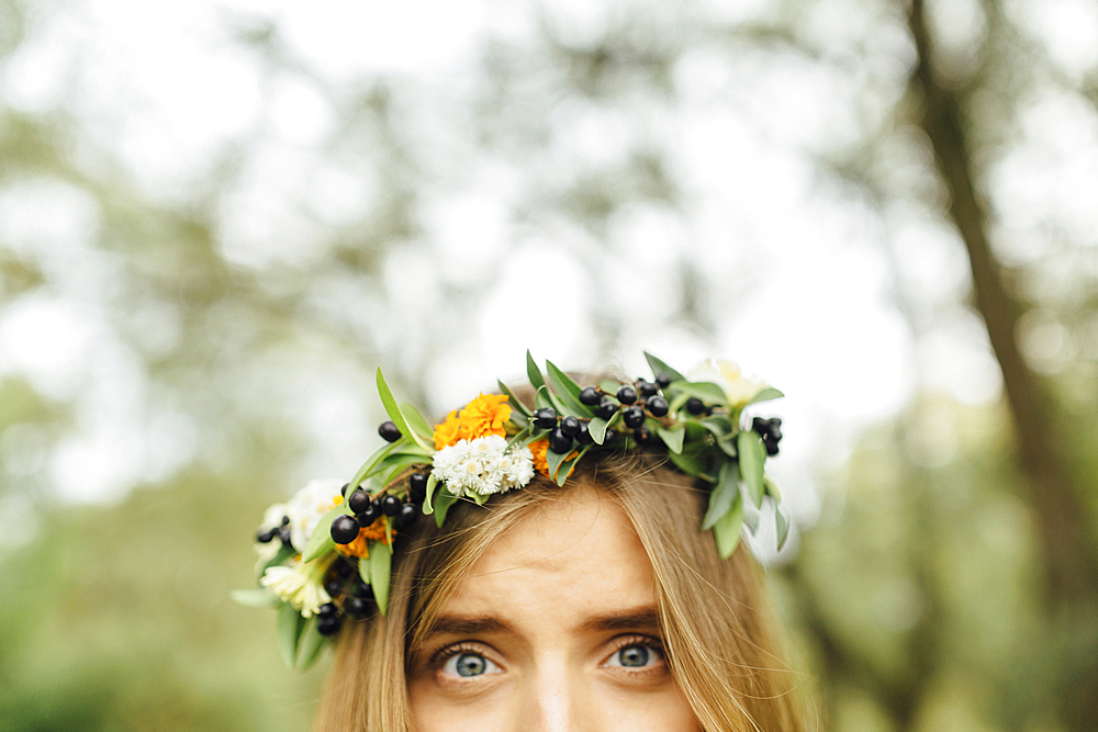 Eyes of Middle Eastern woman wearing flower crown