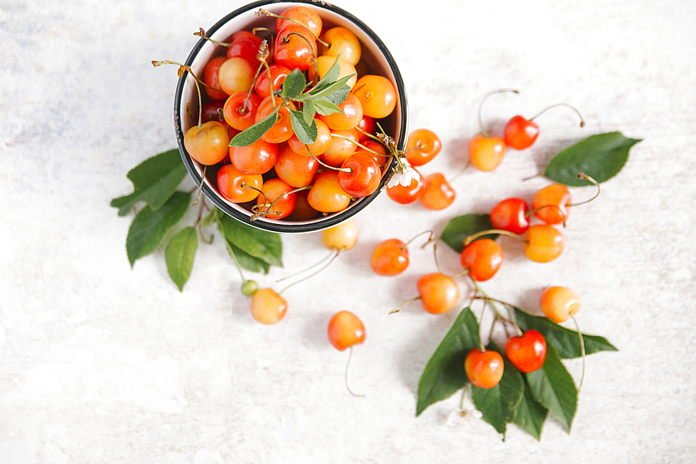 Cherries on white wooden table