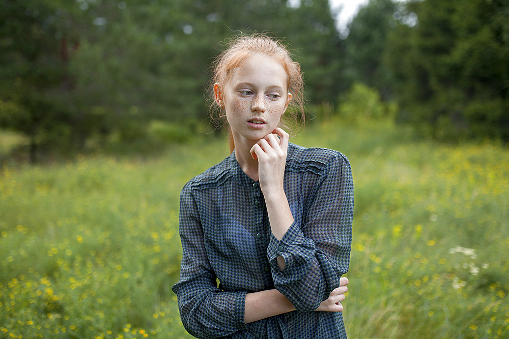 Portrait of Caucasian girl standing in field