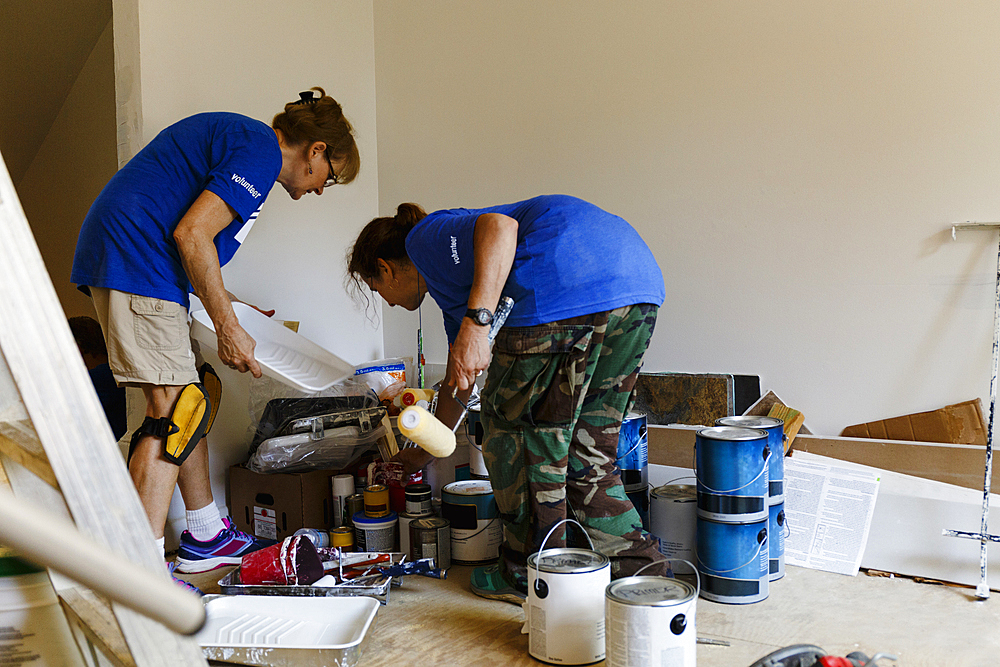 Women preparing to paint walls