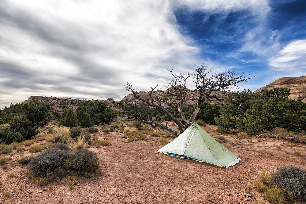 Clouds over tent in desert, Moab, Utah, United States