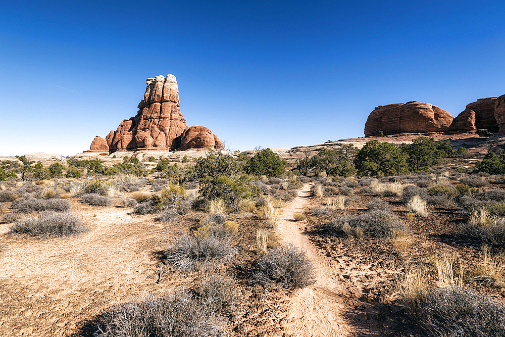 Blue sky over desert path, Moab, Utah, United States