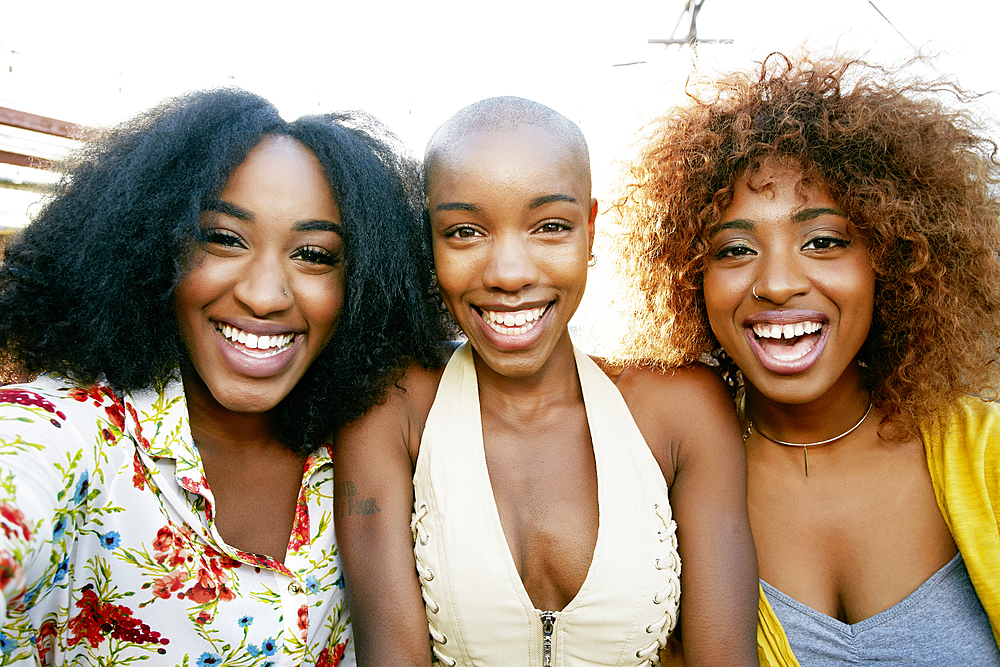 Portrait of women smiling outdoors