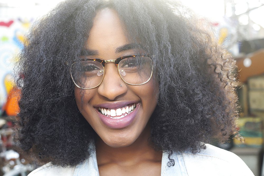 Close up of smiling mixed race woman wearing eyeglasses