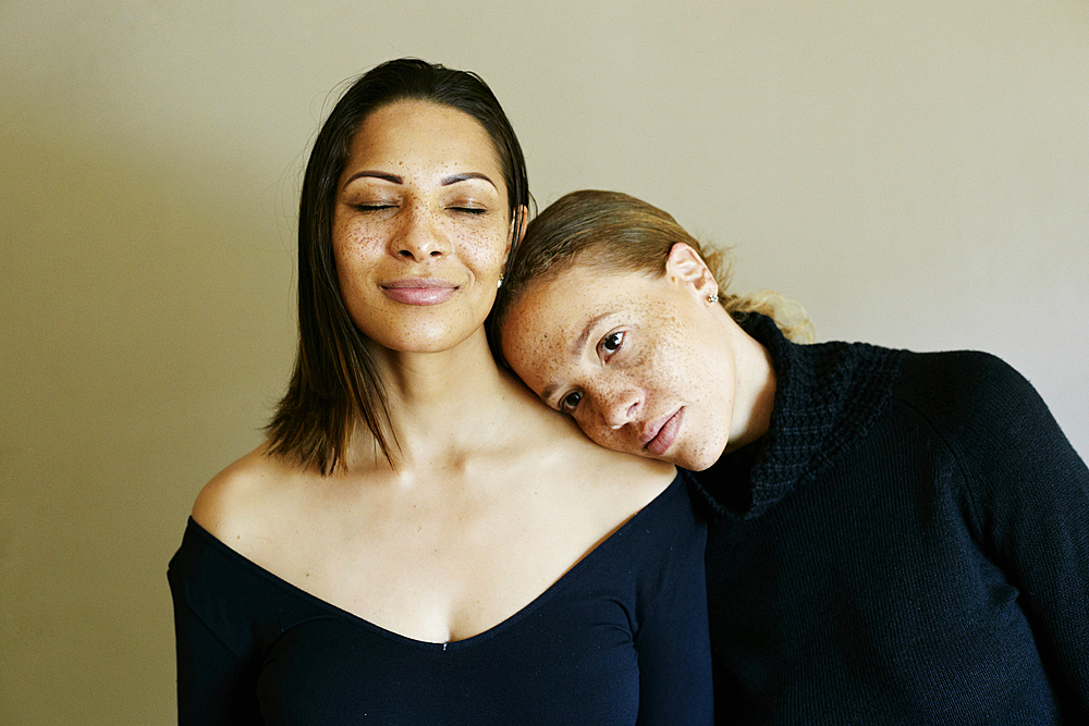 Close up of affectionate mixed race women wearing sweaters