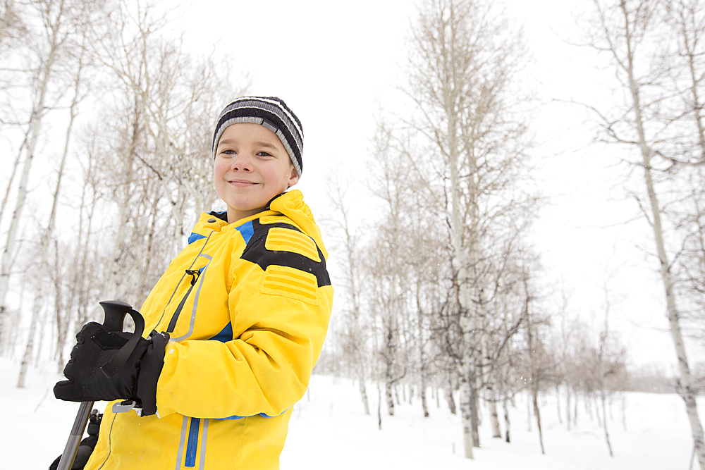 Portrait of smiling Caucasian boy in winter