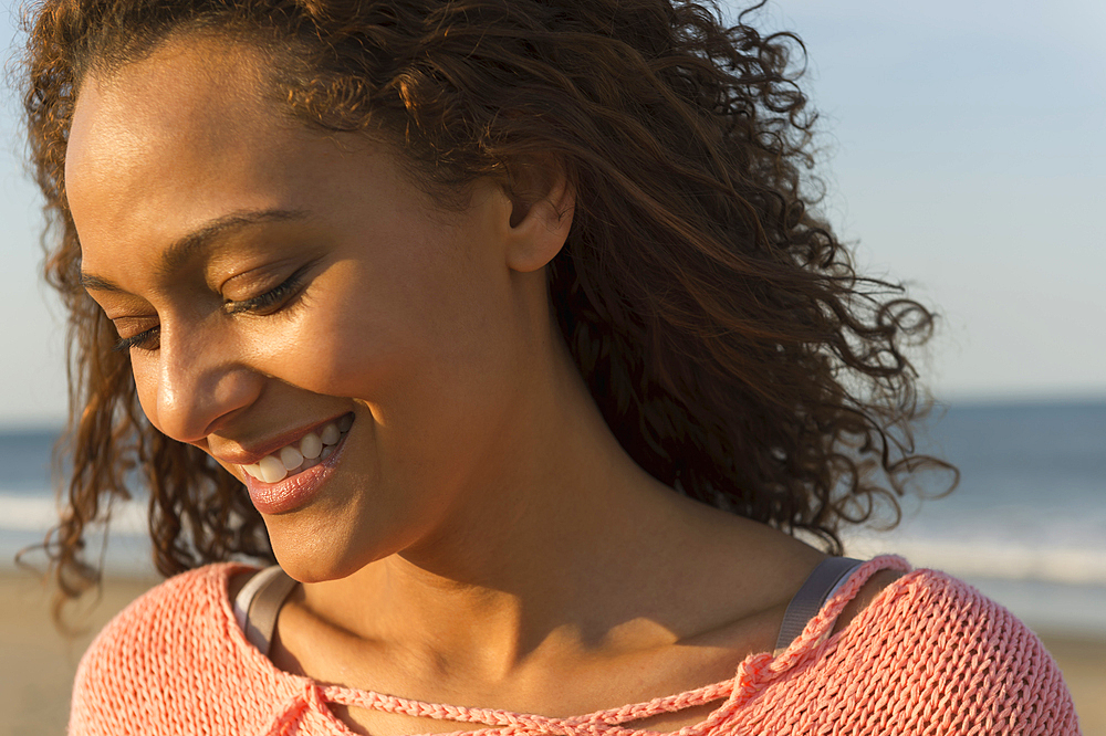 Portrait of smiling African American woman at beach