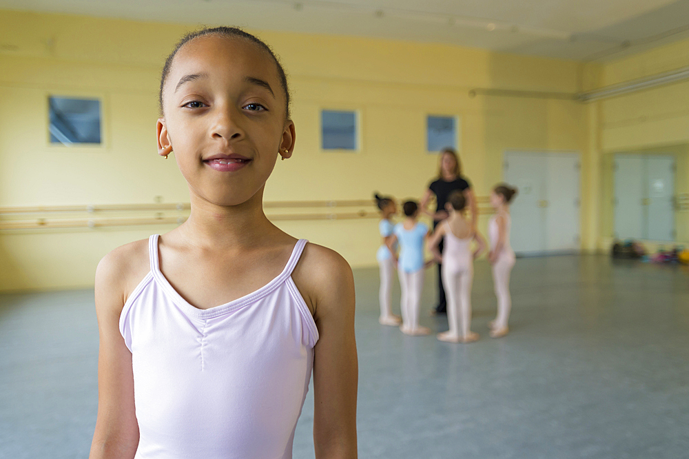 Portrait of smiling girl in ballet studio