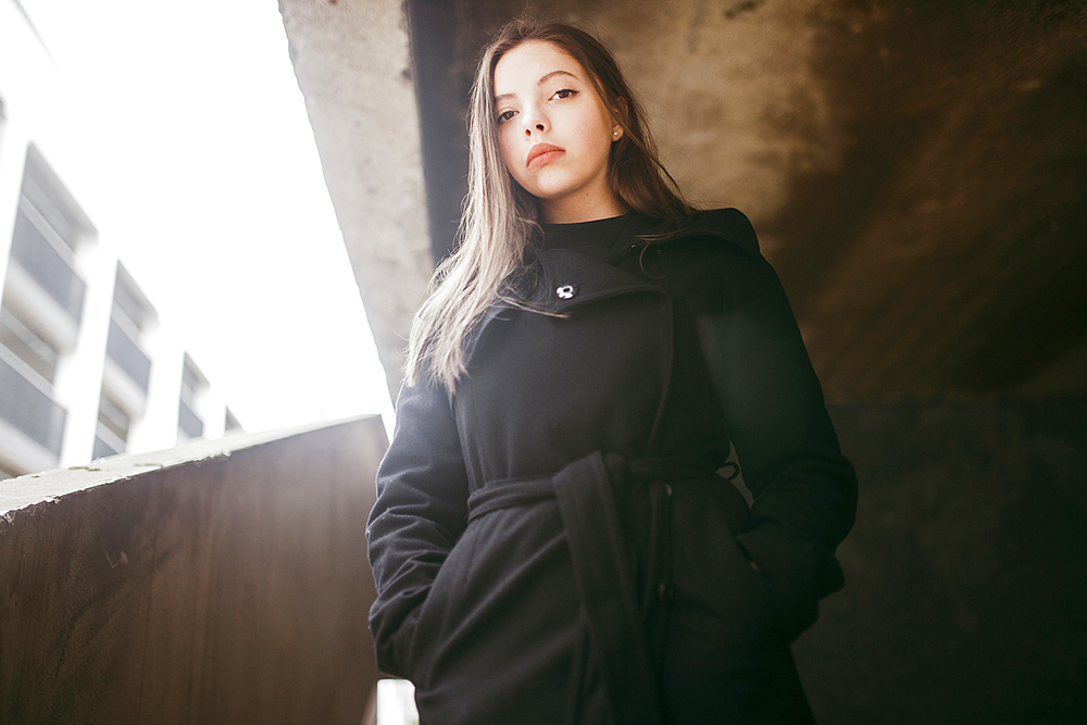 Portrait of serious Caucasian woman wearing black coat