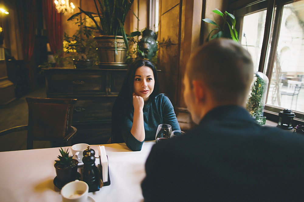 Caucasian couple drinking wine in restaurant