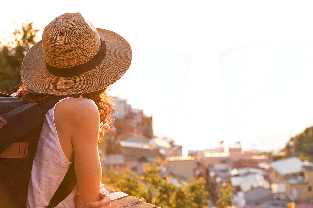 Caucasian woman enjoying scenic view of Manarola, Liguria, Italy