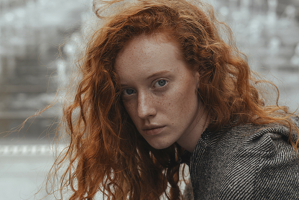 Portrait of serious Caucasian woman with red hair