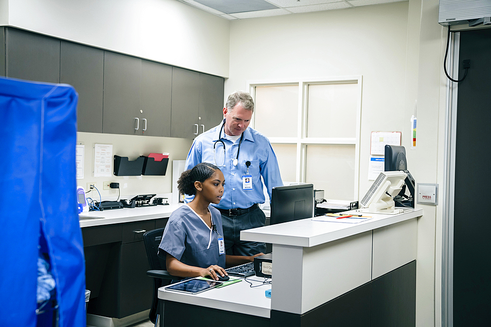 Doctor and nurse using computer in hospital