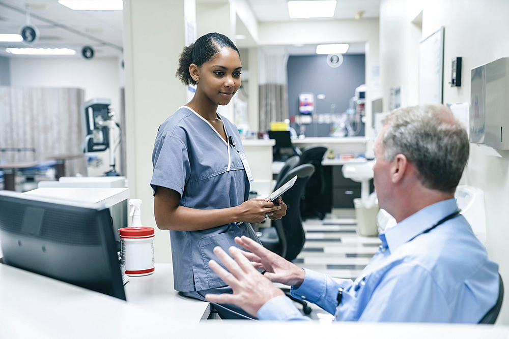 Doctor and nurse talking in hospital