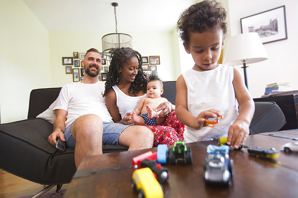 Family relaxing and playing in livingroom