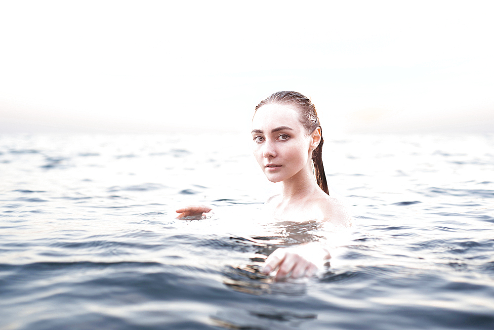 Portrait of serious location woman swimming