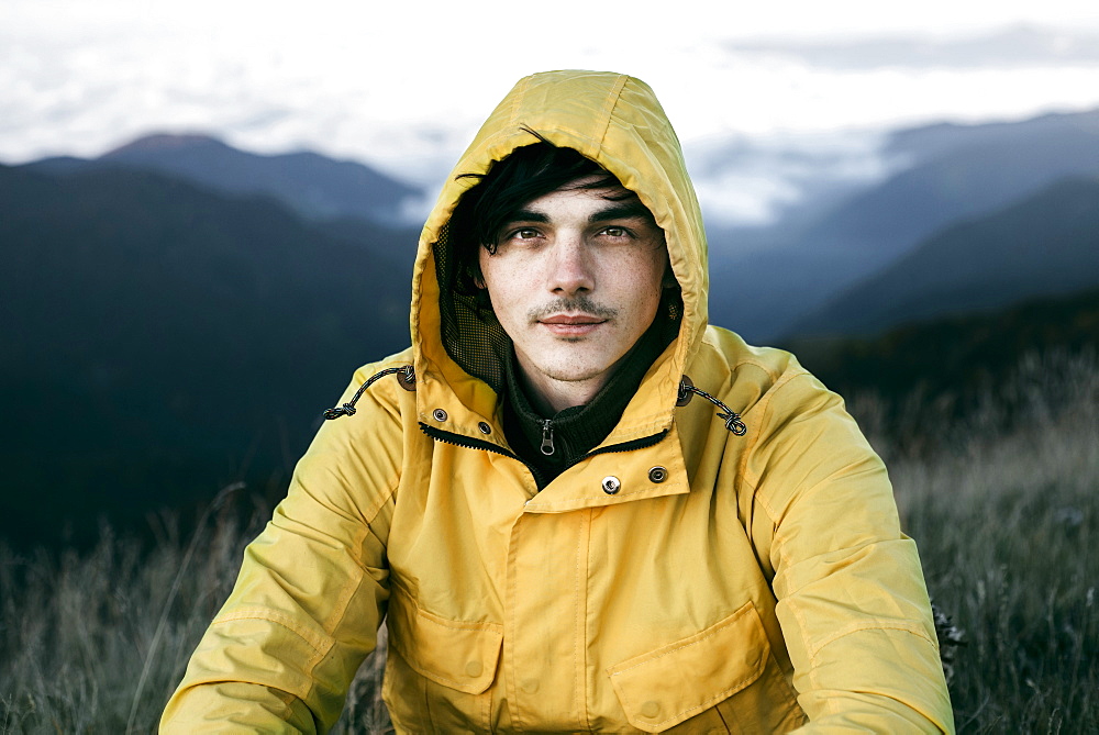 Portrait of Caucasian man in remote mountain landscape