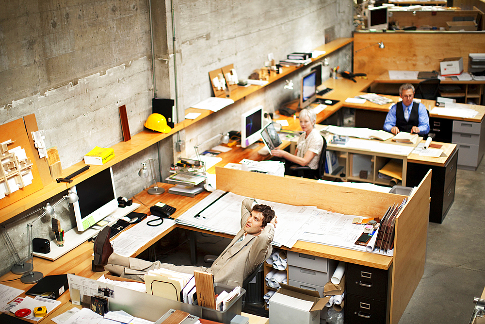 Business people working in busy office