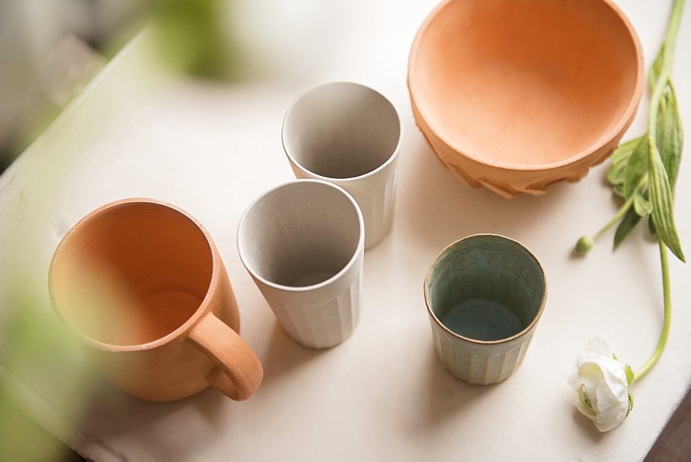 Cups and bowl on table