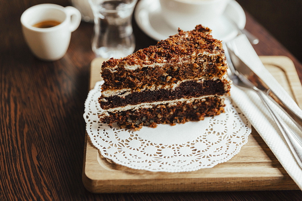 Slice of layer cake on doily