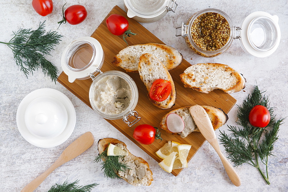 Liver paste and bread on cutting board