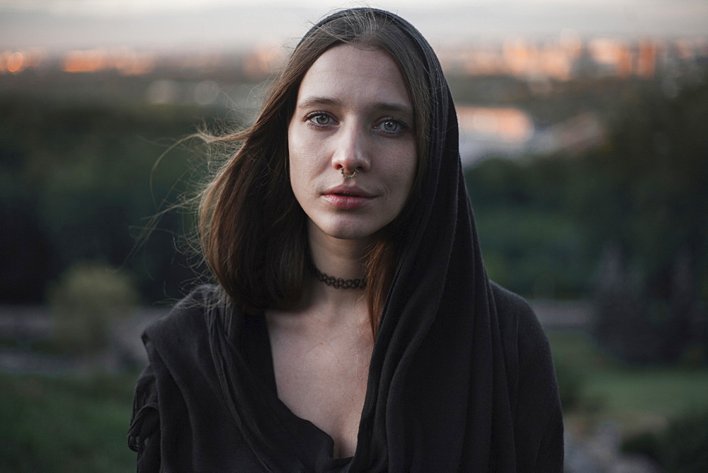 Wind blowing hair of serious Caucasian woman