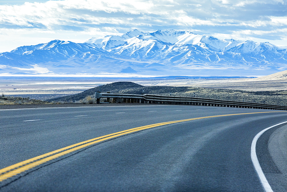 Curving street near mountain range