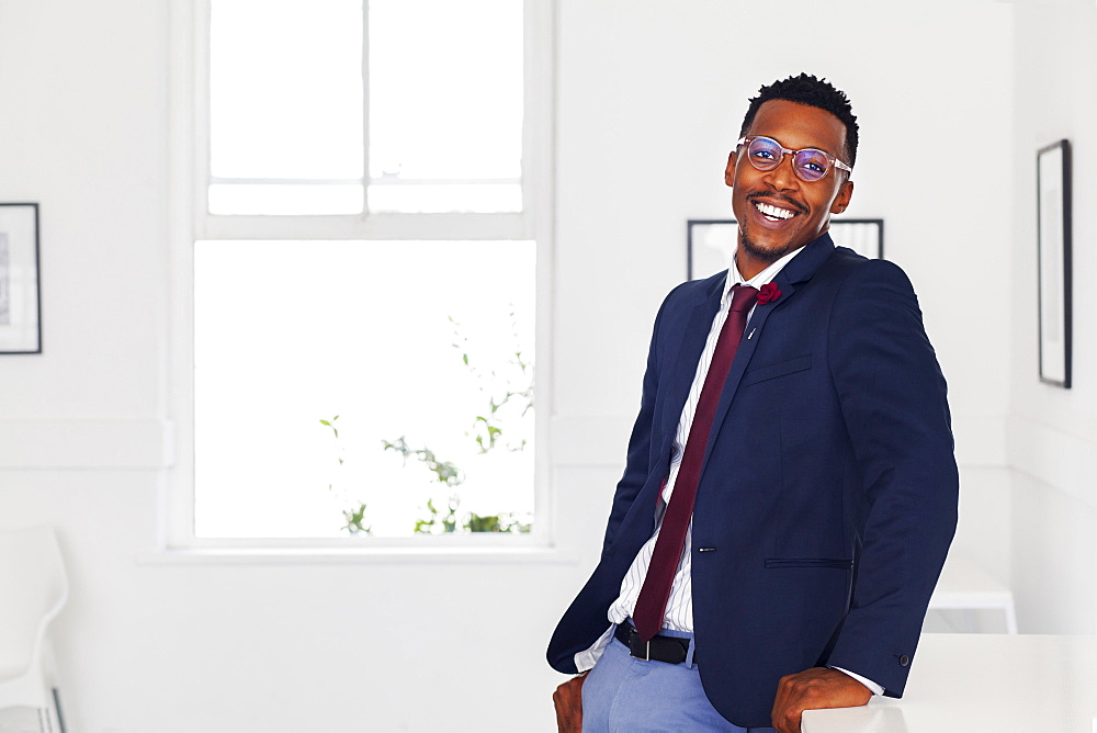 Black man smiling in gallery