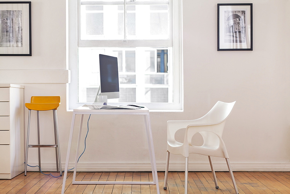 Empty chair and computer