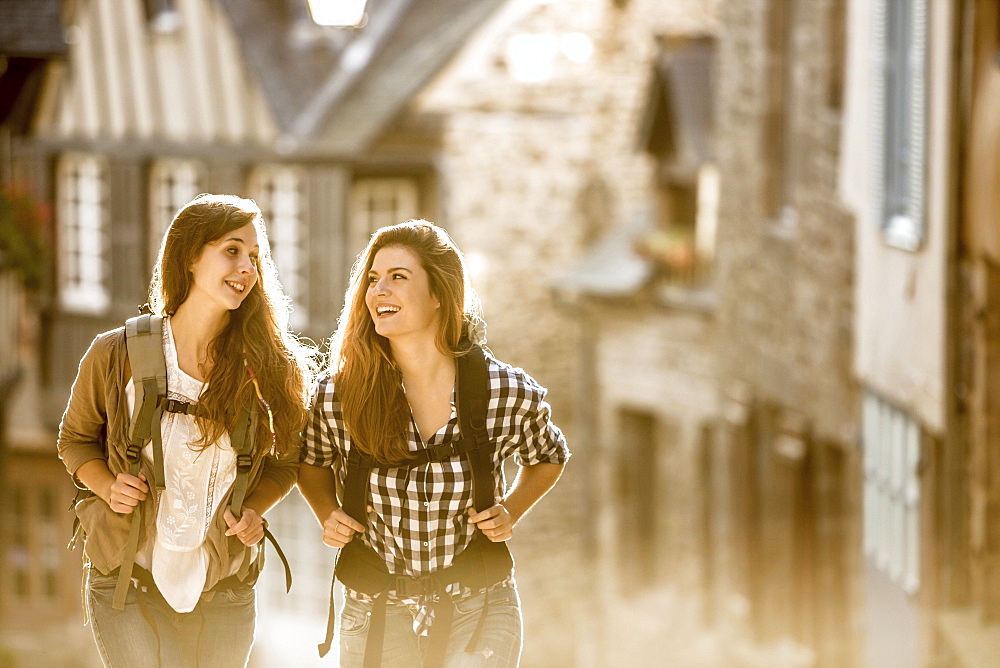 Caucasian women backpacking in city