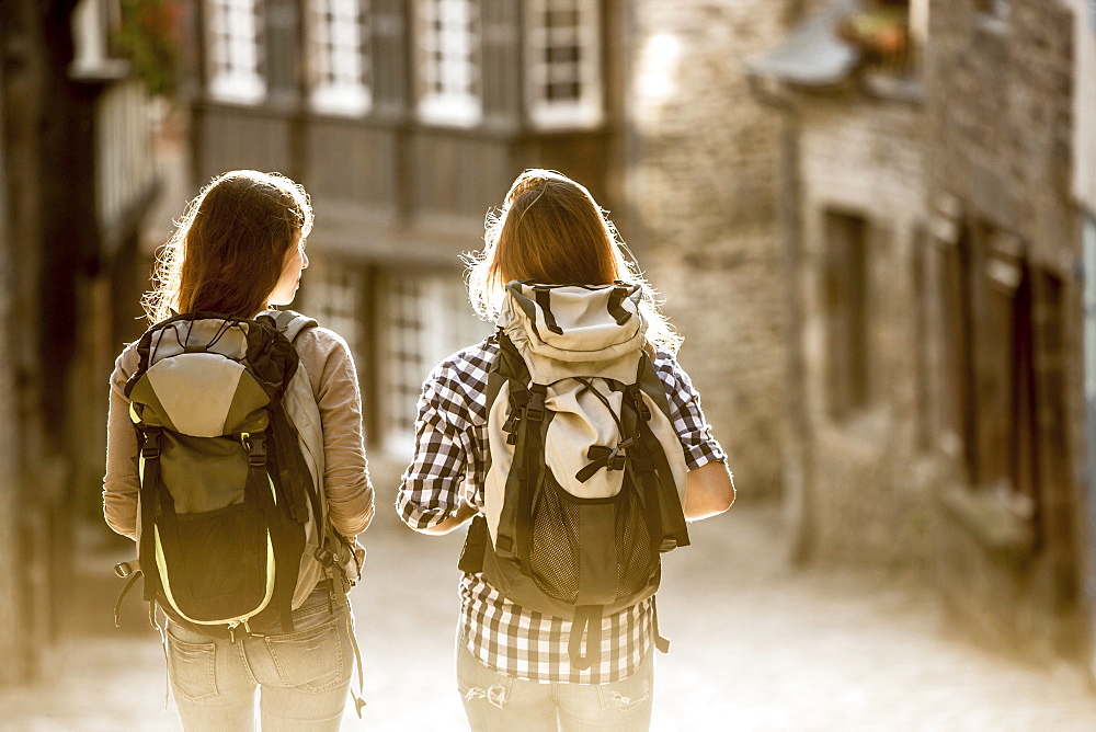 Caucasian women backpacking in city