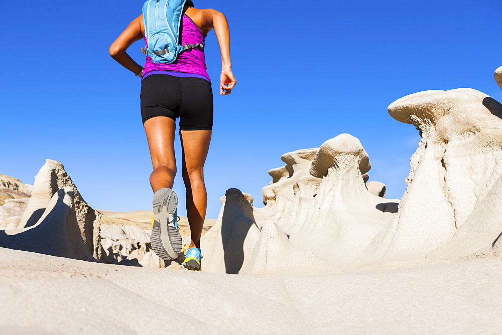 Native American woman running in desert