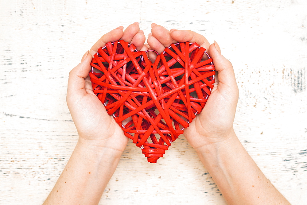 Hands of woman holding handmade valentine