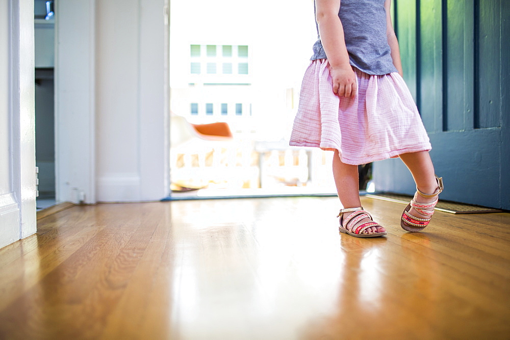 Caucasian girl wearing skirt and sandals