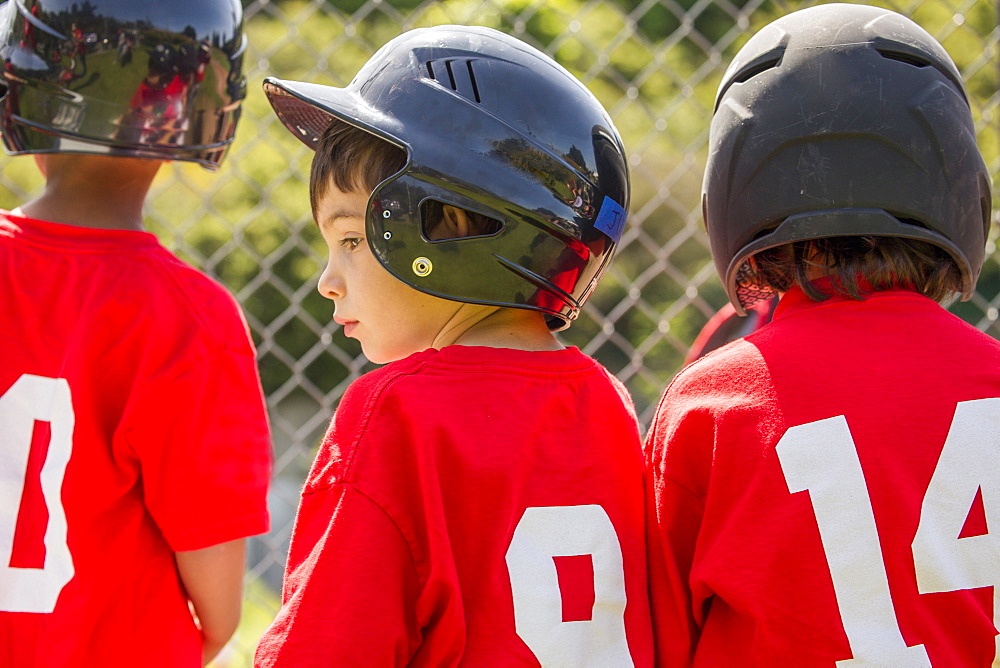 Mixed Race boy playing baseball