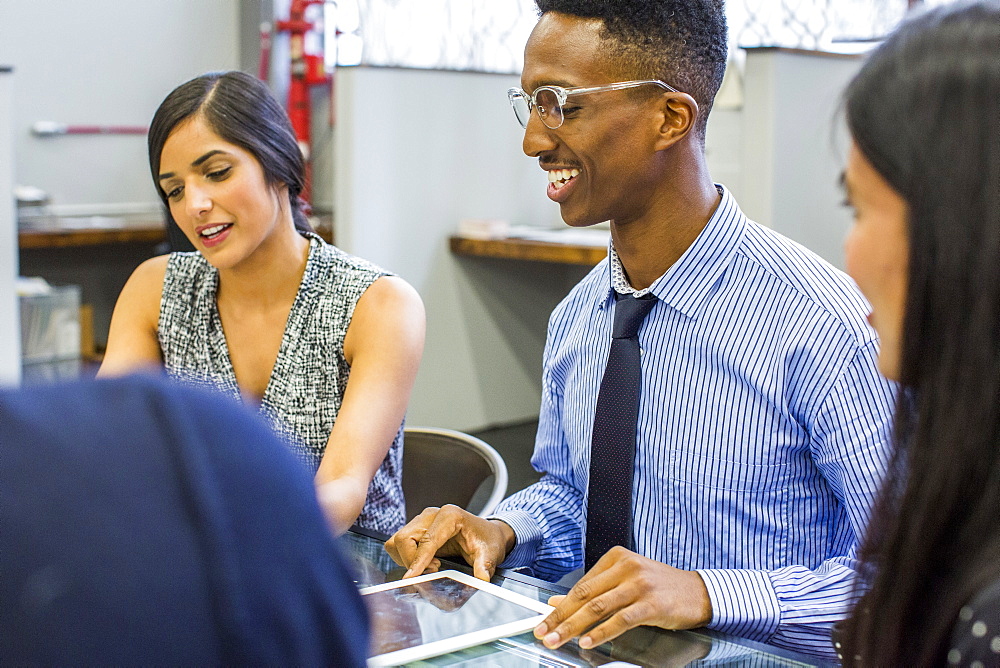 Smiling people talking in meeting