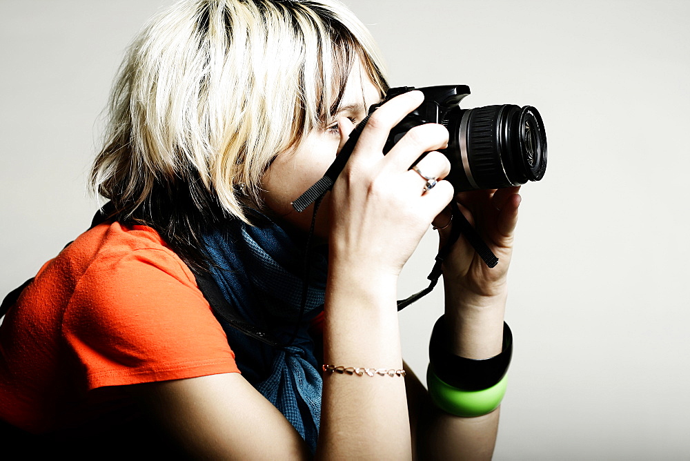 Close up of Caucasian teenage girl photographing with camera