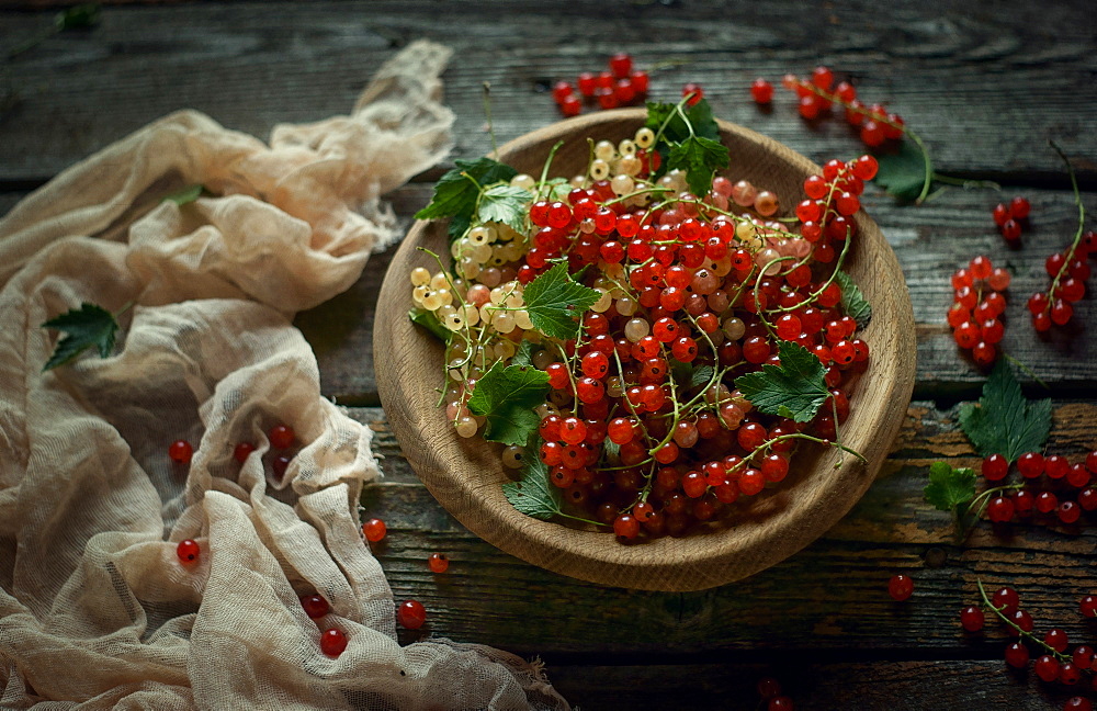 Berries in bowl on wooden table