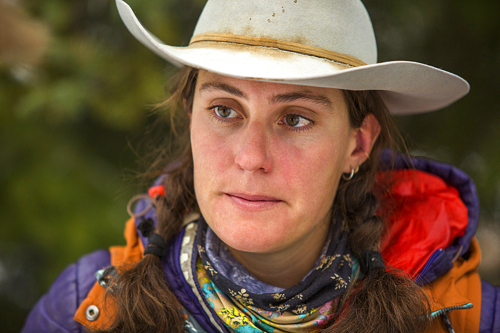 Portrait of serious Caucasian woman wearing cowboy hat