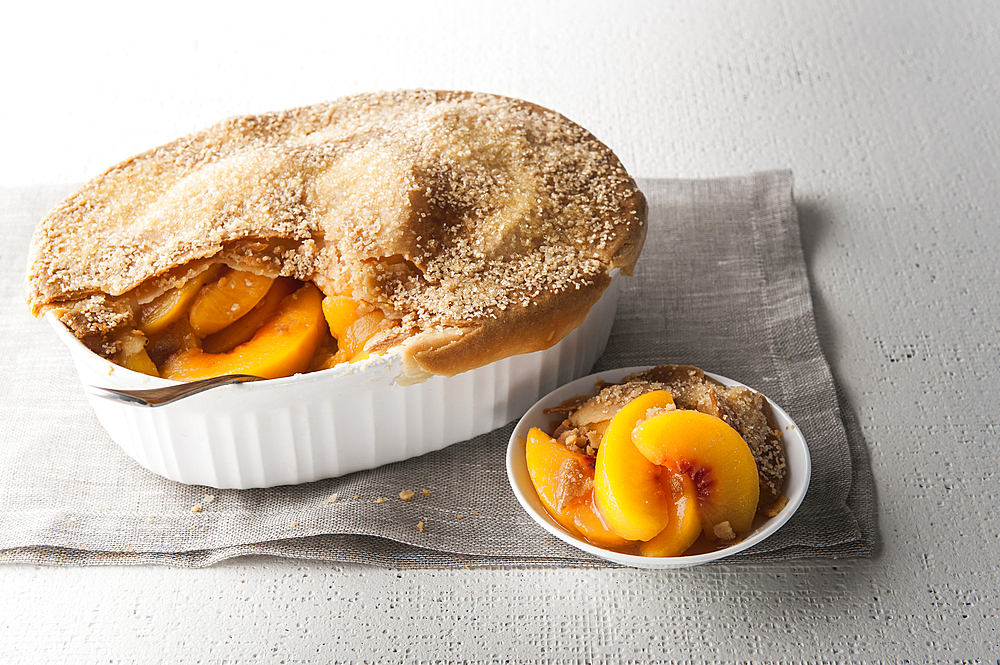 Serving of peach cobbler