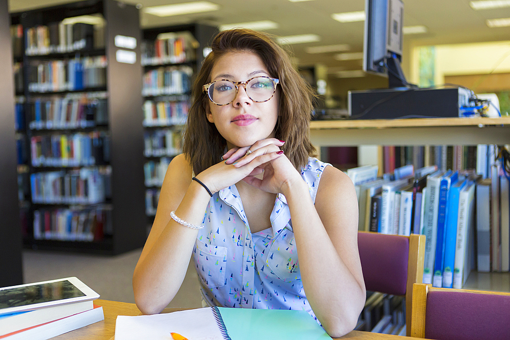 Portrait of Mixed Race girl in library