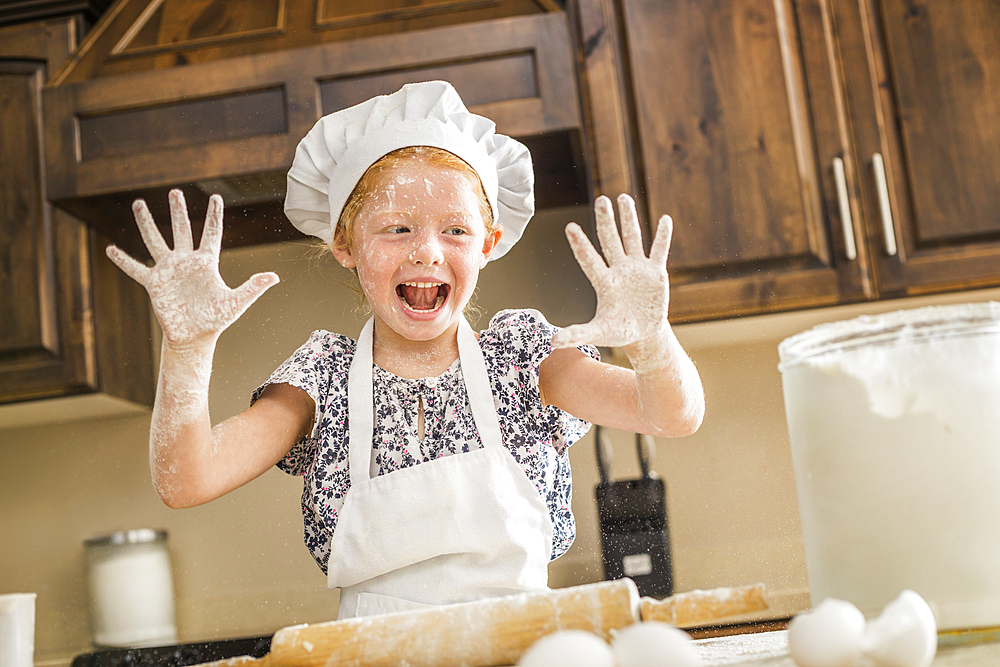 Caucasian girl covered in flour