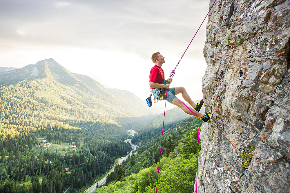 Caucasian man rock climbing