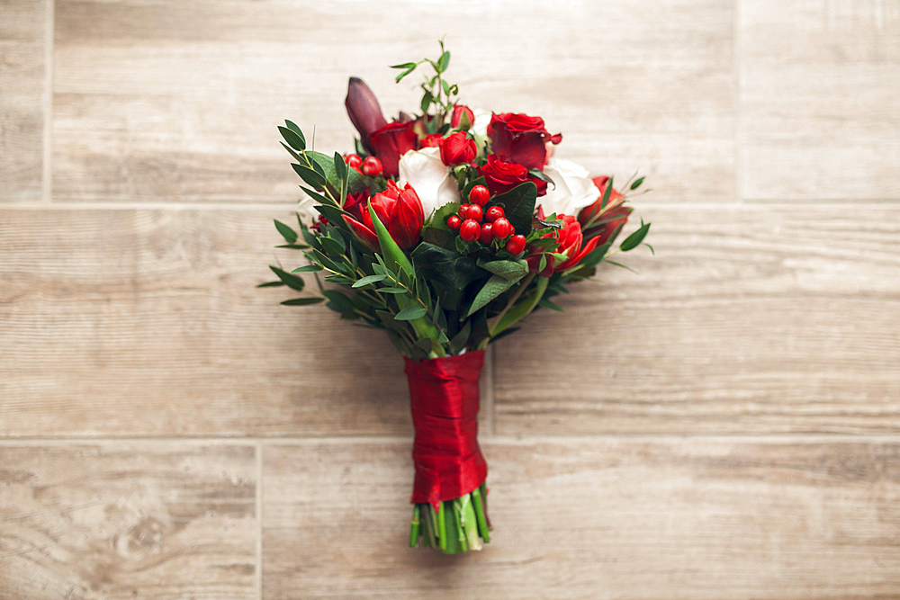 Bouquet of flowers on wooden floor