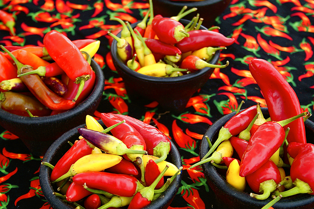 Bowls of yellow and red peppers