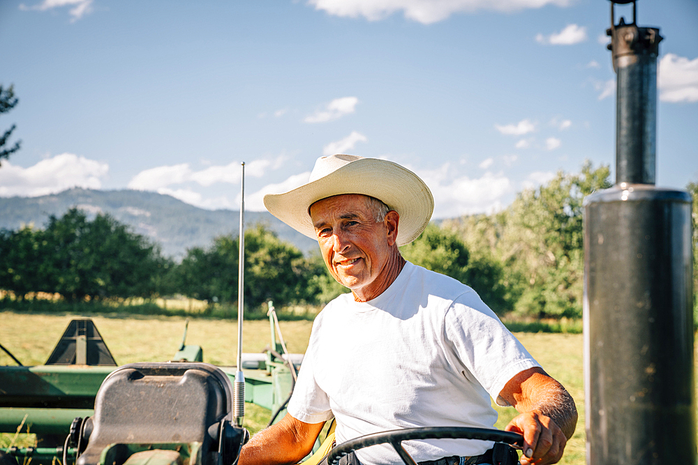 Portrait of Caucasian farmer on tractor