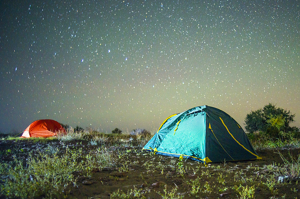 Camping tents under starry sky